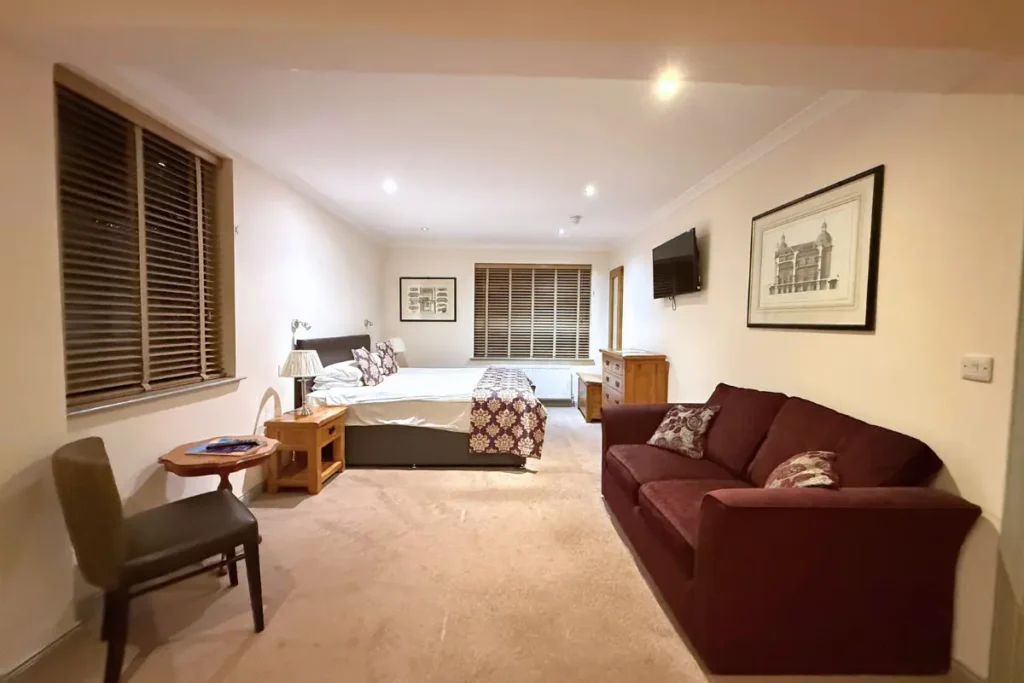 Family Room with double bed and sofa bed at Craigmonie Hotel Inverness