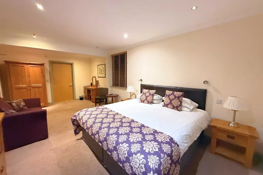 Family Room with double bed and sofa bed at Craigmonie Hotel Inverness